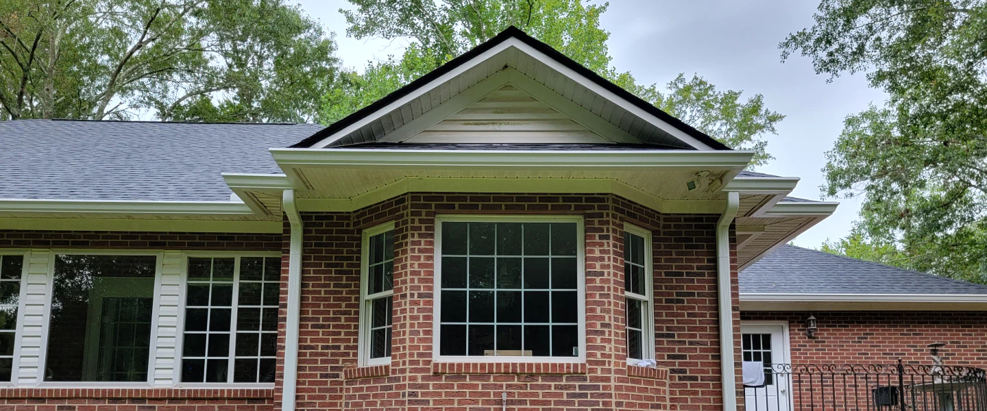 house with new gutters and downspout installed